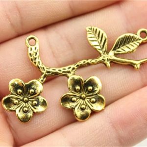 Conector de flores oro antiguo